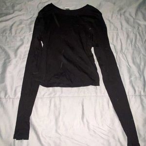 A tight fitted black shirt in good condition!